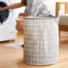 102805-a1d0fb.webp Stylish Checkered Cloth Laundry Basket