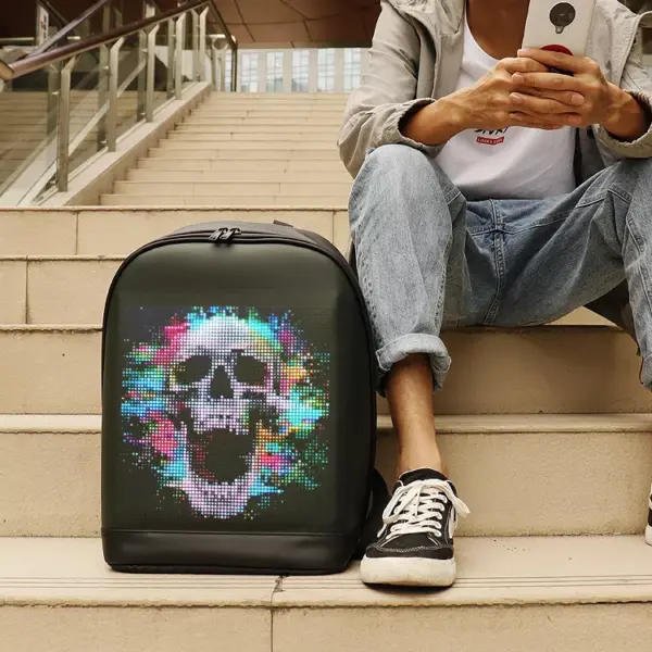95571-10dc81.webp Black programmable LED backpack with full-color dynamic skull screen display worn outdoors