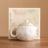 98669-68b6b9.webp Gilded Silver Ceramic Teapot