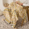 107053-70b35f.webp Bohemian Geometric Knitted Blanket
