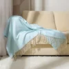 107122-2c5f07.webp Boho-Chic Striped Knitted Blanket with Tassels for Sofa and Bed Decor