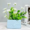 107507-890fe9.webp Chic Ceramic Handbag Vase