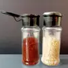 112708-460666.webp Eco-Friendly 100ML Spice & Condiment Shaker Jars - Perfect for Kitchen Organization