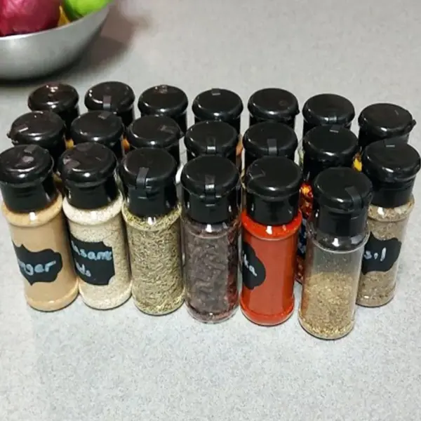 112708-b324bf.webp Eco-Friendly 100ML Spice & Condiment Shaker Jars - Perfect for Kitchen Organization